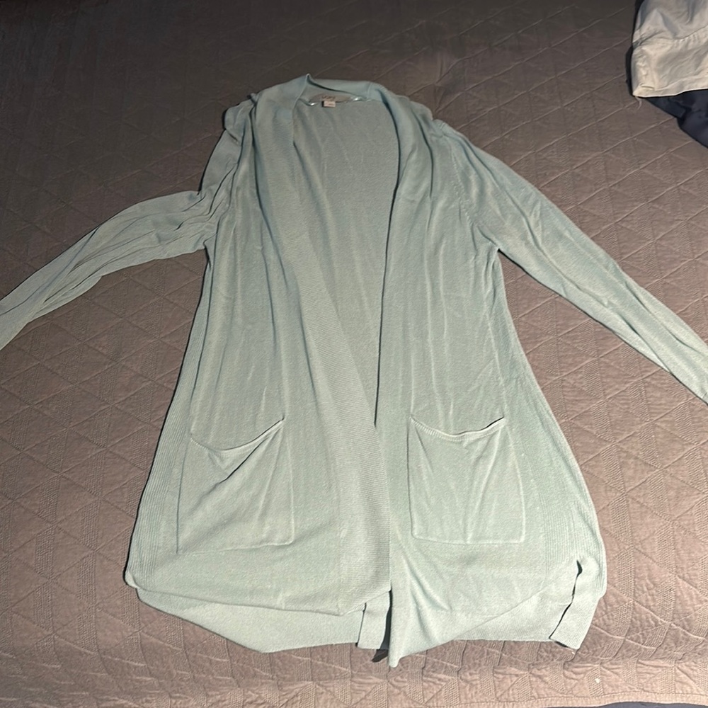 Light green/teal long sleeve knit cardigan with pockets.